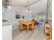 Open-concept living space with a view of the living room, dining area and kitchen at 421 Cerromar Ter # 471, Venice, FL 34293