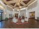 Beautiful lobby with high ceilings, pendant lighting, and comfortable seating arrangement on decorative rug at 421 Cerromar Ter # 471, Venice, FL 34293