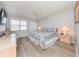 Comfortable bedroom with a ceiling fan, lots of natural light and calming color palette at 421 Cerromar Ter # 471, Venice, FL 34293