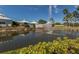 Picturesque pond featuring a beautiful fountain and lush landscaping, creating a serene and inviting community space at 421 Cerromar Ter # 471, Venice, FL 34293