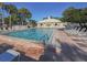 Inviting community pool with plenty of lounge chairs, perfect for relaxation and enjoying sunny days at 421 Cerromar Ter # 471, Venice, FL 34293