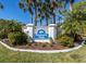 Welcome to Farmington Vistas sign, nestled amongst swaying palm trees and greenery at 421 Cerromar Ter # 471, Venice, FL 34293