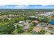 Overhead view showcasing a quiet residential neighborhood with mature landscaping at 427 Autumn Chase Dr, Venice, FL 34292