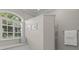 Bright bathroom featuring an arched window, shower and a built-in bench at 427 Autumn Chase Dr, Venice, FL 34292