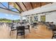Bright dining area with floor-to-ceiling windows offering stunning views of the golf course at 427 Autumn Chase Dr, Venice, FL 34292