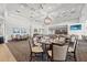 Elegant dining room featuring neutral tones, modern lighting, and neatly arranged tables at 427 Autumn Chase Dr, Venice, FL 34292