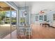 Dining area featuring sliding glass doors to the patio, leading into the connected living area at 427 Autumn Chase Dr, Venice, FL 34292