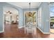 Dining room features decorative lighting, an open floor plan, and access to a covered outdoor living area at 427 Autumn Chase Dr, Venice, FL 34292