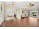 Inviting living room with hardwood floors, decorative furnishings, and a doorway to another living area at 427 Autumn Chase Dr, Venice, FL 34292