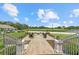 Scenic outdoor firepit area with golf course views, perfect for relaxing and entertaining at 427 Autumn Chase Dr, Venice, FL 34292