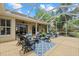 The screened patio offers comfortable seating, outdoor entertaining, with open views of surrounding landscape at 427 Autumn Chase Dr, Venice, FL 34292