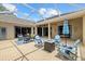 The screened patio featuring comfortable furniture and outdoor entertaining space at 427 Autumn Chase Dr, Venice, FL 34292