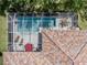 Aerial view of screened-in pool and patio area with outdoor seating at 463 Park Trace Blvd, Osprey, FL 34229
