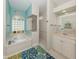Bright bathroom featuring a soaking tub with glass block window and separate shower at 463 Park Trace Blvd, Osprey, FL 34229