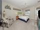 Relaxing bedroom with a queen bed, soft carpet, and access to the outdoors at 463 Park Trace Blvd, Osprey, FL 34229