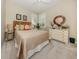 Bedroom with neutral tones, a large window, and woven accents at 463 Park Trace Blvd, Osprey, FL 34229