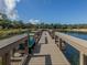 Fishing pier on a lake with bench and scenic views at 463 Park Trace Blvd, Osprey, FL 34229
