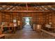 Rustic, wood-lined interior showcasing views of the waterfront over the dock at 463 Park Trace Blvd, Osprey, FL 34229
