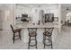 Spacious kitchen featuring a large island with seating and stainless steel appliances at 463 Park Trace Blvd, Osprey, FL 34229