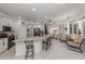 Open kitchen with a large island, seating, and seamless flow into the dining and living areas at 463 Park Trace Blvd, Osprey, FL 34229