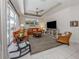 Cozy living room with comfortable seating, a large window, and a ceiling fan at 463 Park Trace Blvd, Osprey, FL 34229