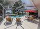 Enjoy the Florida lifestyle with this home's private screened pool, lanai and serene lake view at 463 Park Trace Blvd, Osprey, FL 34229