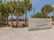 Welcoming Siesta Beach tennis courts, a Sarasota County Park, with nearby lush greenery and palm trees at 463 Park Trace Blvd, Osprey, FL 34229