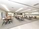 Well-lit activity room features tables, chairs, and ample storage cabinets at 485 Schooner St, North Port, FL 34287