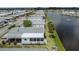 Aerial view of a well-maintained property near a tranquil lake at 485 Schooner St, North Port, FL 34287