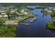 Aerial view of waterfront homes in a vibrant community with private boat docks and lush landscaping at 485 Schooner St, North Port, FL 34287