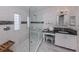 A primary bathroom featuring a glass enclosed shower and modern fixtures for a luxurious spa experience at 485 Schooner St, North Port, FL 34287