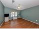 A cozy bedroom featuring hardwood floors, natural light and a ceiling fan for added comfort at 485 Schooner St, North Port, FL 34287