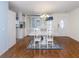 A view of the Dining Room, white table set, chandelier and view of the kitchen at 485 Schooner St, North Port, FL 34287