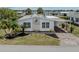 Charming home features a carport and a well-manicured landscaped yard at 485 Schooner St, North Port, FL 34287