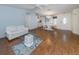 Bright living room flows to dining area, featuring hardwood floors at 485 Schooner St, North Port, FL 34287