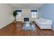 Bright living room with hardwood floors, fireplace, and ample natural light at 485 Schooner St, North Port, FL 34287