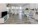 A bright sunroom with waterfront views, creating a peaceful and relaxing living space with lots of natural light at 485 Schooner St, North Port, FL 34287