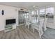 A bright sunroom with waterfront views, creating a peaceful and relaxing dining and living space at 485 Schooner St, North Port, FL 34287