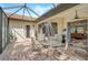 Relaxing screened in patio with an outdoor dining area and views of the interior at 4912 Bella Terra Dr, Venice, FL 34293