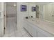 Bright bathroom featuring a vanity with sink, mirror, and walk-in shower with a bathtub at 528 W Venice Ave # 1, Venice, FL 34285
