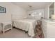 Bright bedroom with white furniture, ceiling fan, and window at 528 W Venice Ave # 1, Venice, FL 34285