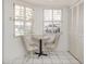 Sunny kitchen nook features a small table with seating for two at 528 W Venice Ave # 1, Venice, FL 34285