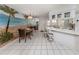 Bright dining room with tile flooring, wall art, and bar stool seating at 528 W Venice Ave # 1, Venice, FL 34285