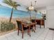 Dining room features wood table and chairs plus a mural wall at 528 W Venice Ave # 1, Venice, FL 34285