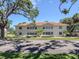 Multi-Gathering home with a red tile roof and neatly maintained landscaping at 528 W Venice Ave # 1, Venice, FL 34285
