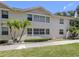 Two-story home with many windows and manicured landscaping at 528 W Venice Ave # 1, Venice, FL 34285