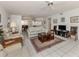 Inviting living room featuring tile flooring, comfortable seating, and an open layout to other rooms at 528 W Venice Ave # 1, Venice, FL 34285