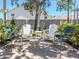 Four chairs and table sit on a shaded patio at 528 W Venice Ave # 1, Venice, FL 34285