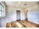 Bedroom with hardwood floors, large closet, and natural light at 533 Shamrock Blvd, Venice, FL 34293