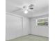 Bedroom featuring a ceiling fan, window, and a closet at 541 Zephyr Rd, Venice, FL 34293